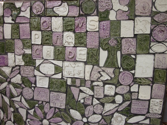 Pass by the mosaic, in the women's movement colours of green, purple and white
